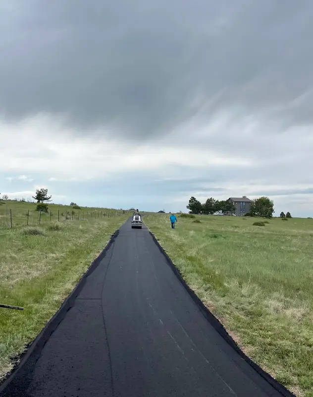 Long asphalt driveway in Lone Tree being installed