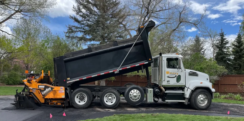 Asphalt being installed on a driveway